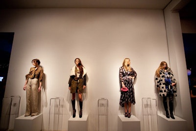 The venue's main hallway was turned into a display area where 16 models on pedestals showcased looks from the different 'boutiques' on Google's site. To encourage movement, the producers placed two 10-foot-long satellite bars at each end of the corridor.