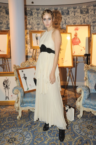Guests including Leelee Sobieski (pictured), Emma Roberts, and Sofia Coppola waited in the salon before entering the pop-up shop in the Wedgewood Room. The producers used this area to display Elbaz's sketches of the collection, which were up for auction.
