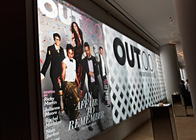 To draw attention to the 2010 Out 100 honorees, Here Media and production partner Shiraz Events used the IAC Building's 120-foot-long wall to change the event's backdrop three times during the evening. The imagery used to correspond with the editorial feature's Black and White Ball-inspired look included a lattice pattern, which added texture and dimension to the step-and-repeat.