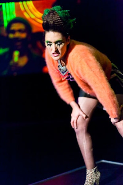 A model wore a punk-inspired outfit featuring leopard-print booties and a pink mohair cardigan, styled by Danielle Kupsc and Kendra Amin Dufton.