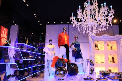 A chandelier festooned with blue lights hangs over the shop.