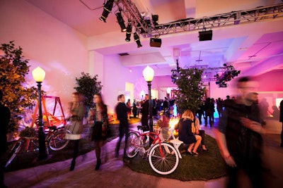 A variety of plaid pillows and runners decorated the space, along with vintage-style bicycles and baskets of flowers.