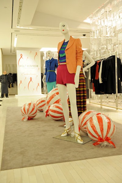 Holt Renfrew dressed a cocktail space on the second floor of the retailer's flagship store with oversize candy decorations and red and white Canfar ribbons.