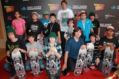 Kids posed with skateboards on the event's red carpet.
