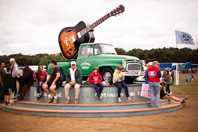 A real-life version of the Life Is Good logo—a pickup truck hoisting an oversize guitar—was placed in the center of the field. The truck-and-guitar motif was mirrored on festival T-shirts, as well.