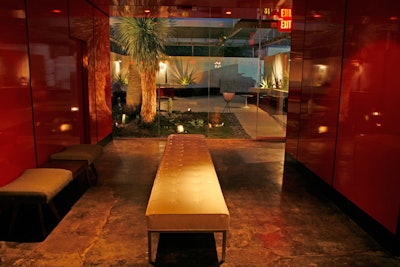 A long white bench leads to the venue's outdoor area.