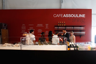 Pop-up Cafe Assouline has items such as salads, sandwiches, cupcakes, and cheese platters—prepared by Shiraz Events—for sale, along with drinks.
