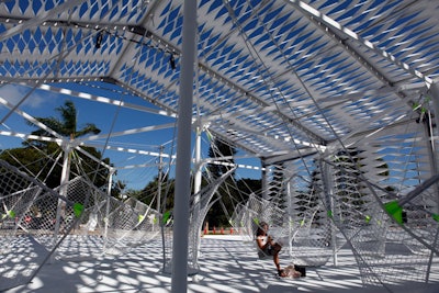 Grcic also created an outdoor installation for this year's fair. Installed in the courtyard of the temporary structure, 'Netscape' is a star-shaped structure from which 24 seats made of netting are suspended.