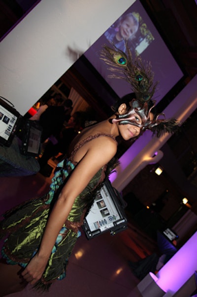At the Food Allergy Initiative benefit, which had a moonlit-forest theme, costumed nymphs showed guests how to bid on wireless devices from Auction and Event Solutions.