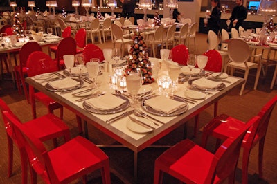 Carol Bearg Jacobson, who designed the event on behalf of Marigolds & Onions, surrounded white Plexiglas tables with red Victoria Ghost chairs.