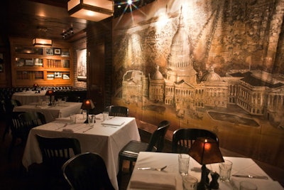 Covering the walls in the main dining room, bar, and private room Sidecar are historic photos and artifacts, including a canvas depicting the U.S. Capitol.