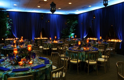 Moroccan decor included blue velvet drapes and hanging lanterns.