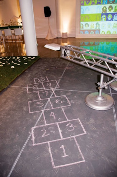 Guests blew bubbles, played hopscotch, doodled on chalkboards, and hung out on an indoor swing set at Chicago's artEdge benefit in May.