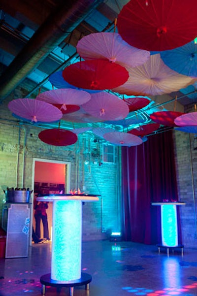 Paper parasol umbrellas hung from the ceiling above the dance floor in a room inspired by a Tokyo love hotel.