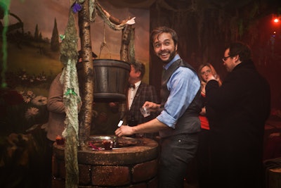 To avoid the typical bar table setups, the event producers created several interactive areas for the mixologists and bartenders, including a wishing-well-like piece that held punch.