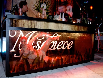 A costumed performer entertained guests at the Hornitos Tequila party during the South Beach Wine and Food Festival from inside the bar at the far end of the Sagamore's pool.