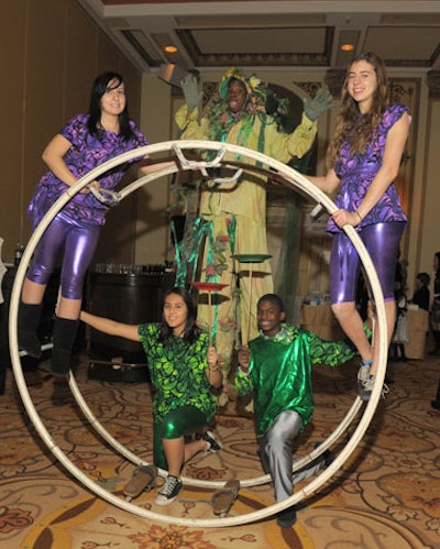 Kids from local nonprofit CircEsteem taught guests to roll in a giant circus wheel.
