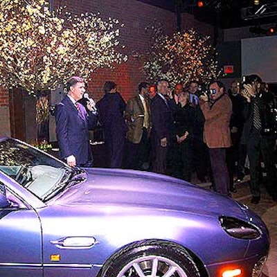 Mike O'Driscoll, president of North American operations of Aston Martin/Jaguar/Land Rover, spoke to guests at the launch party for the Land Rover Discovery 2003, where Avi Adler's spare decor included large arrangements of flowering dogwood branches.