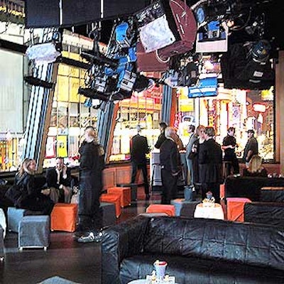 The second floor of Times Square Studios was decorated with orange and gray cube seats and black couches, and offered a great view of Times Square.