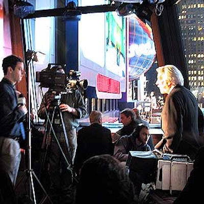 A camera crew interviewed Volvo spokesman Donald Sutherland on the second floor of Times Square Studios.