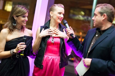 Event host and Boldfacers.com founder Lisa Pierpont (far left) joined event MC Fast Freddy of Mix 104.1 (far right) on the runway to chat with a model about her rock-inspired look.