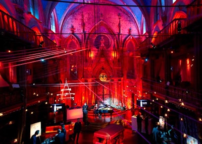 Washed in red and blue lighting, the Angel Orensanz Foundation served as the site for Bacardi's first 'Legacy of the Cocktail' competition in New York. To highlight the brand's heritage, the event's producers looked to traditional Cuban street markets for design inspiration.