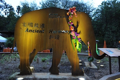 Flowers decked elephant likenesses rendered in metal.