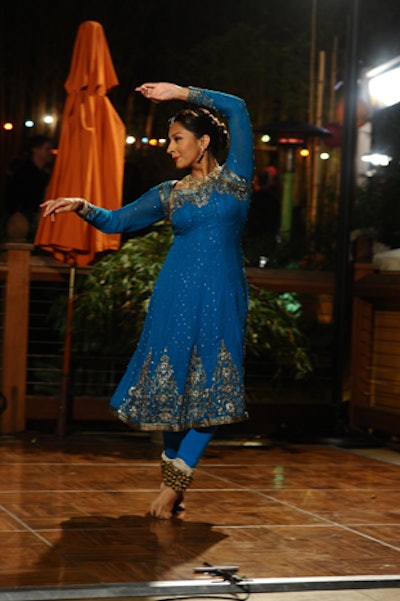 Dancers and singers performed in colorful garb at the Los Angeles Zoo's opening for its new elephant habitat.