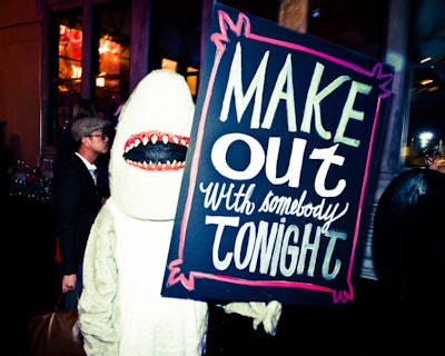 A series of costumed mascots, including a kangaroo, parrot, shark, and rabbit, greeted guests with signs announcing different aspects of the party—including the silent auction benefiting the New Museum.