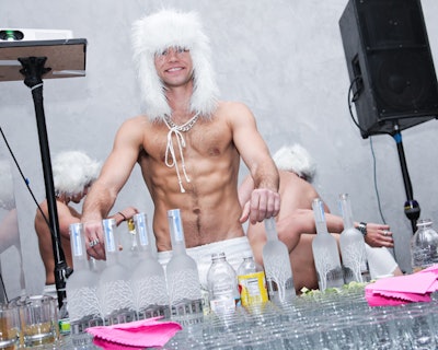 Belvedere Vodka, a party sponsor, stocked the two bars in the main party room with ample liquor. Like the female servers, the model bartenders were dressed in skimpy white outfits.