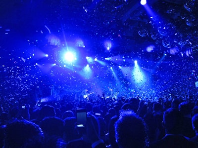 Confetti canons and a giant cluster of disco balls over the dance floor made for a festive New Year's Eve experience at the concert.