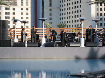 Mavis Staples and her band performed on a stage behind the pool during the New Year's Day barbecue.