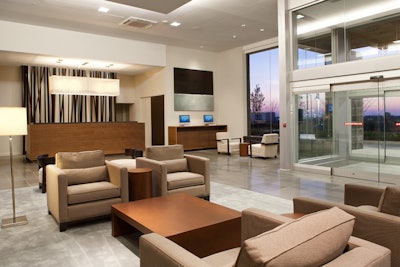 Design elements at the new Novotel Toronto Vaughan Centre include a two-sided fireplace in the lobby and a cascading water feature on the patio.