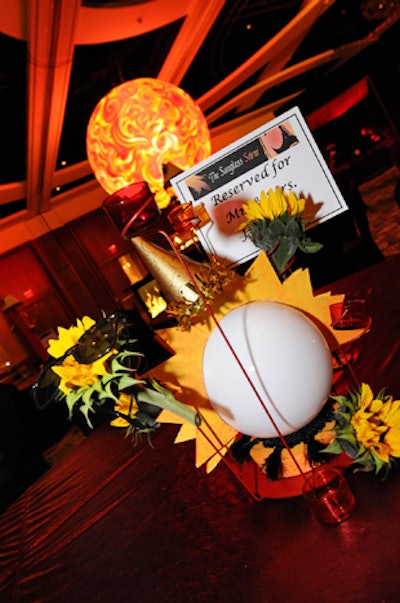 Flourish Floral Productions used sunflowers in the centerpieces and topped some of them with sunglasses.