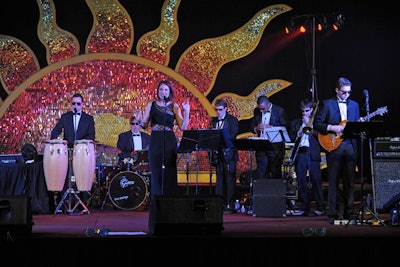 The Malones provided the evening's primary entertainment on a stage backed by a shimmering sun.