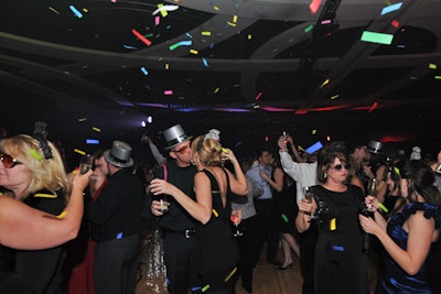 A champagne toast and party favors filled the ballroom at midnight in celebration of the new year.