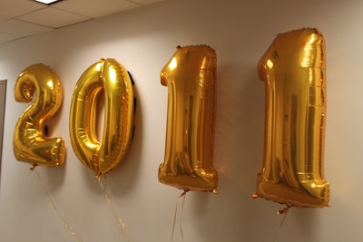 Oversized '2011' balloons greeted guests at the party entrance.