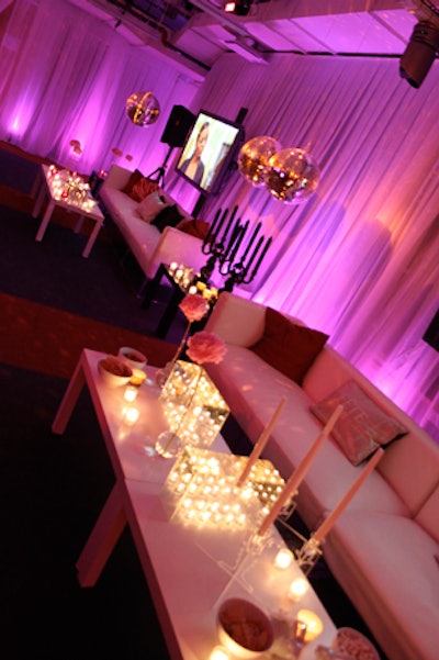 Disco balls, candelabras, and oversized couches decorated the party space.