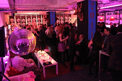 The Fete team swathed the two big columns in the middle of the office-turned-party space in black cashmere, attached cardboard deer heads reminiscent of Cohen's clubhouse set, and created seating around the base.