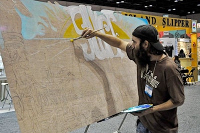 Artist Bean Spence worked throughout the expo to create a 3-D painting.