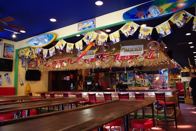 The bar at Paradise Cantina offers thematic drinks such as frozen margaritas.