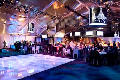 After the viewing dinner, the event opened up to several hundred additional after-party guests, who grooved on a white dance floor to old-school hip-hop tunes spun by MC Lyte.