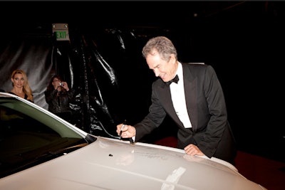 Celebrities signed one of the three display cars for charity.