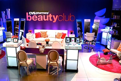 Within Access Hollywood's fifth annual “Stuff You Must…” lounge at the Sofitel, produced by On 3 Productions, Jes Gordon Proper Fun designed a salon-style space for CVS, with pink and orange callas, decorative rocks scattered among the products, and logos displayed in mirrored frames. The clean, simple look included white furniture and silver flooring, and it infused the room with bright, vibrant colors for a feminine, yet cozy feel.