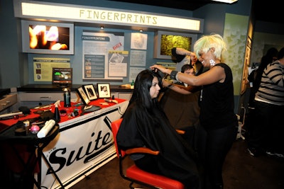 The Suite Barbershop also had a stylist cutting hair in the C.S.I. Experience.