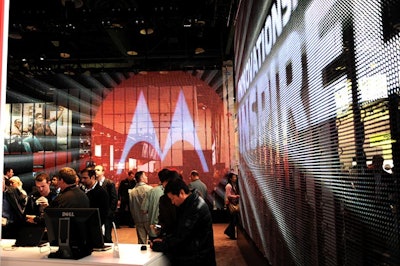 Monster LED screens served as exhibit space walls in Motorola's black-, red-, and white-dominated space.