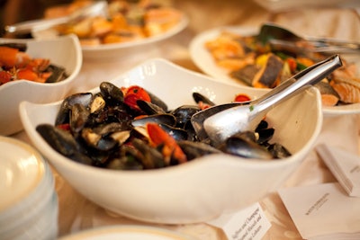A hot-and-cold dinner buffet included foods paired with white and red wines, such as this dish of Champagne-steam mussels and Maine lobster.