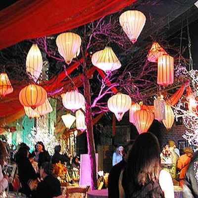 American Foliage and Design Group created an intimate nighttime setting decorated with hanging lanterns and crystal beaded trees.