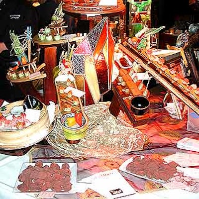 Allure Catering's display-only food props were situated on a wooden stand decorated with stained glass. American Foliage and Design Group provided the linens.
