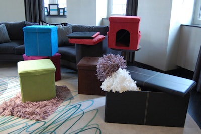 Organizers used the suite's living room to showcase foldable ottomans in purple, green, and blue from the FHE Group's spring/summer collection.